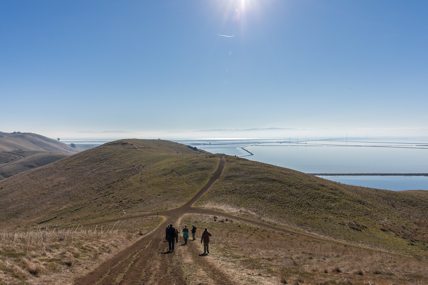 Hikers cautiously descending a section of the Red Hill trail